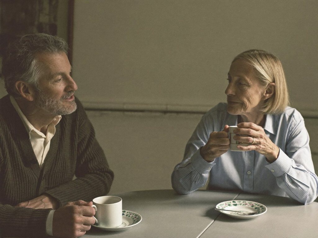 Couple talking at a kitchen table